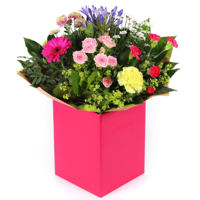 Petal Paradise - A lively bouquet featuring a bright mix of vibrant seasonal blooms. Complemented by lush green foliage and presented in a beautiful packaging, this arrangement is perfect for adding a pop of colour to any occasion